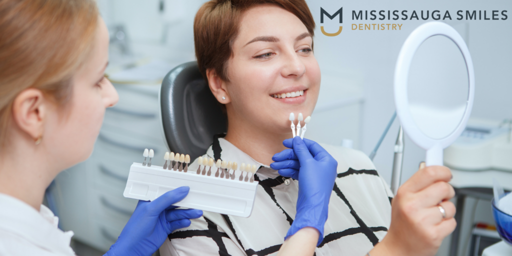 Professional cosmetic dentist examining patient's smile at Mississauga Smiles Dentistry